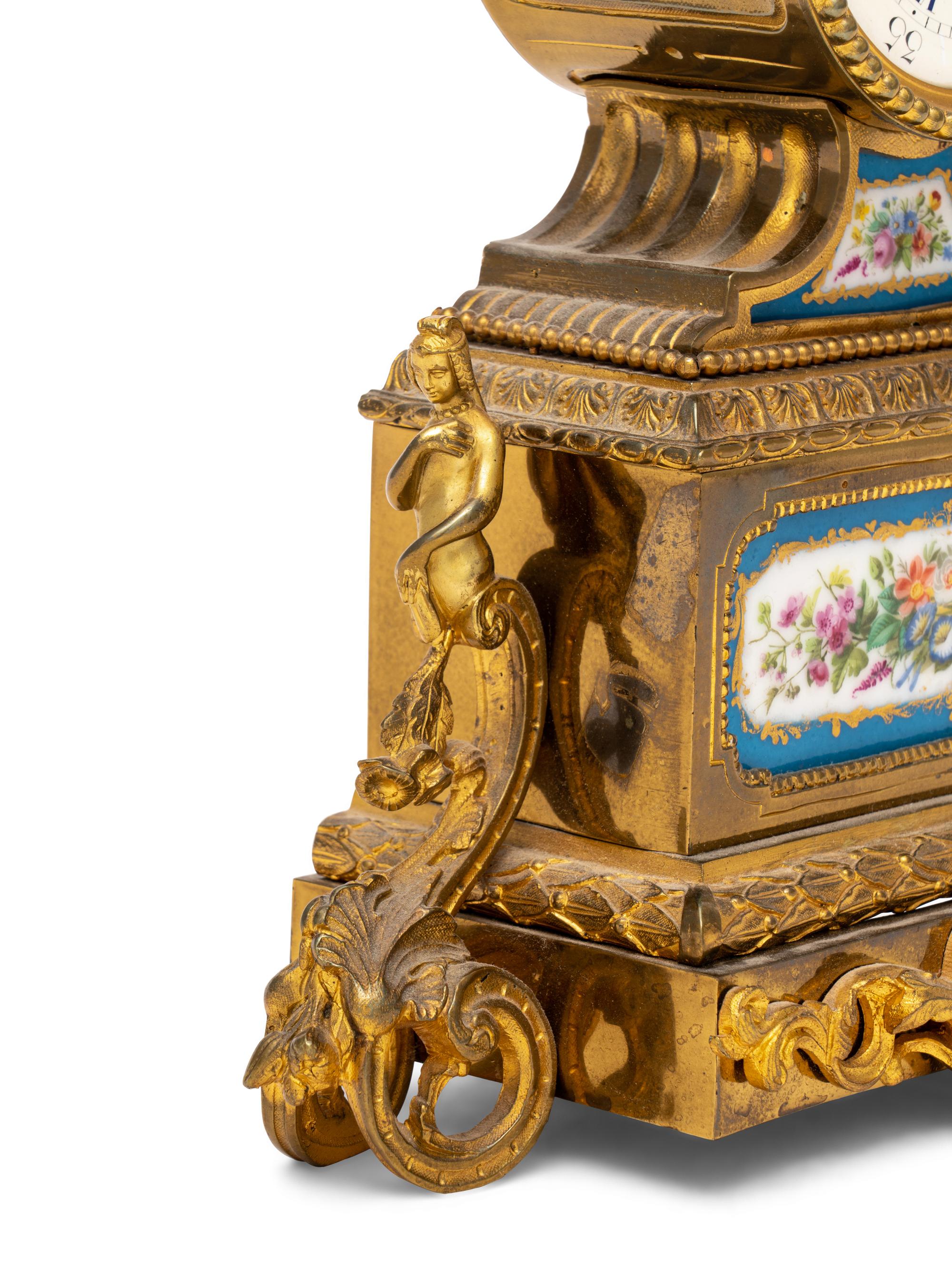A French Gilt Metal and Porcelain Clock