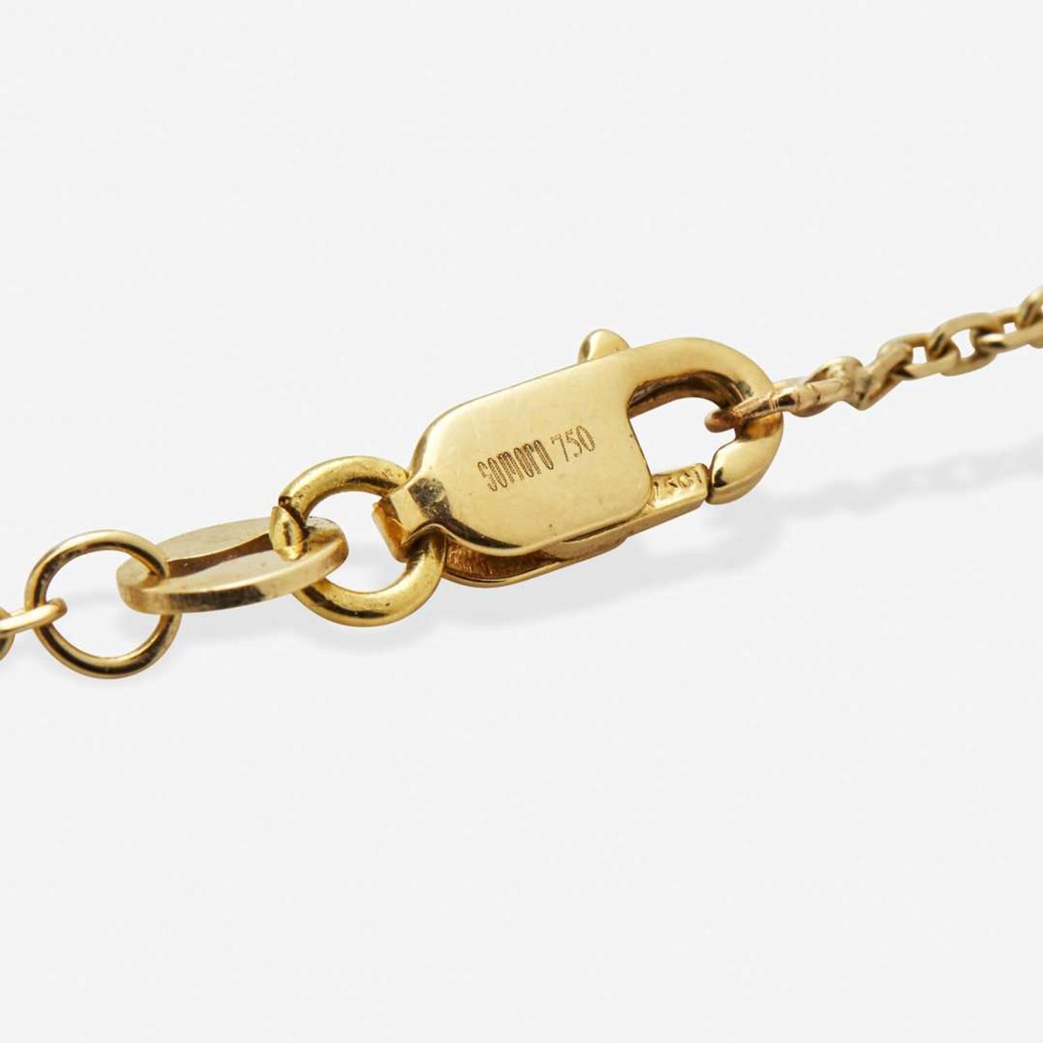 An 18K Yellow Gold Black Diamond and Diamond Pendant on a 14K Chain