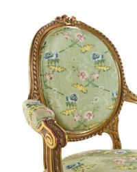 A Set of Four Louis XVI Style Carved Giltwood Fauteuils