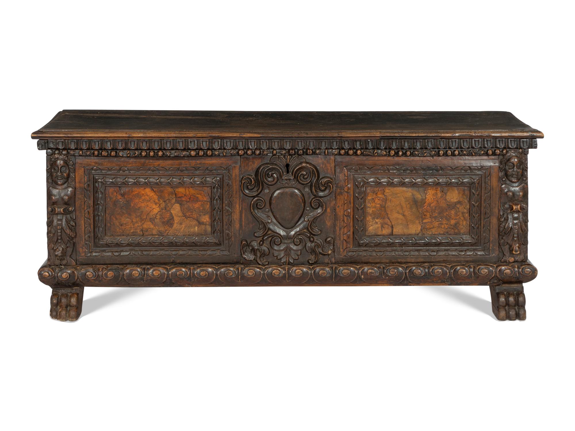 An Italian Baroque Carved Walnut Cassone