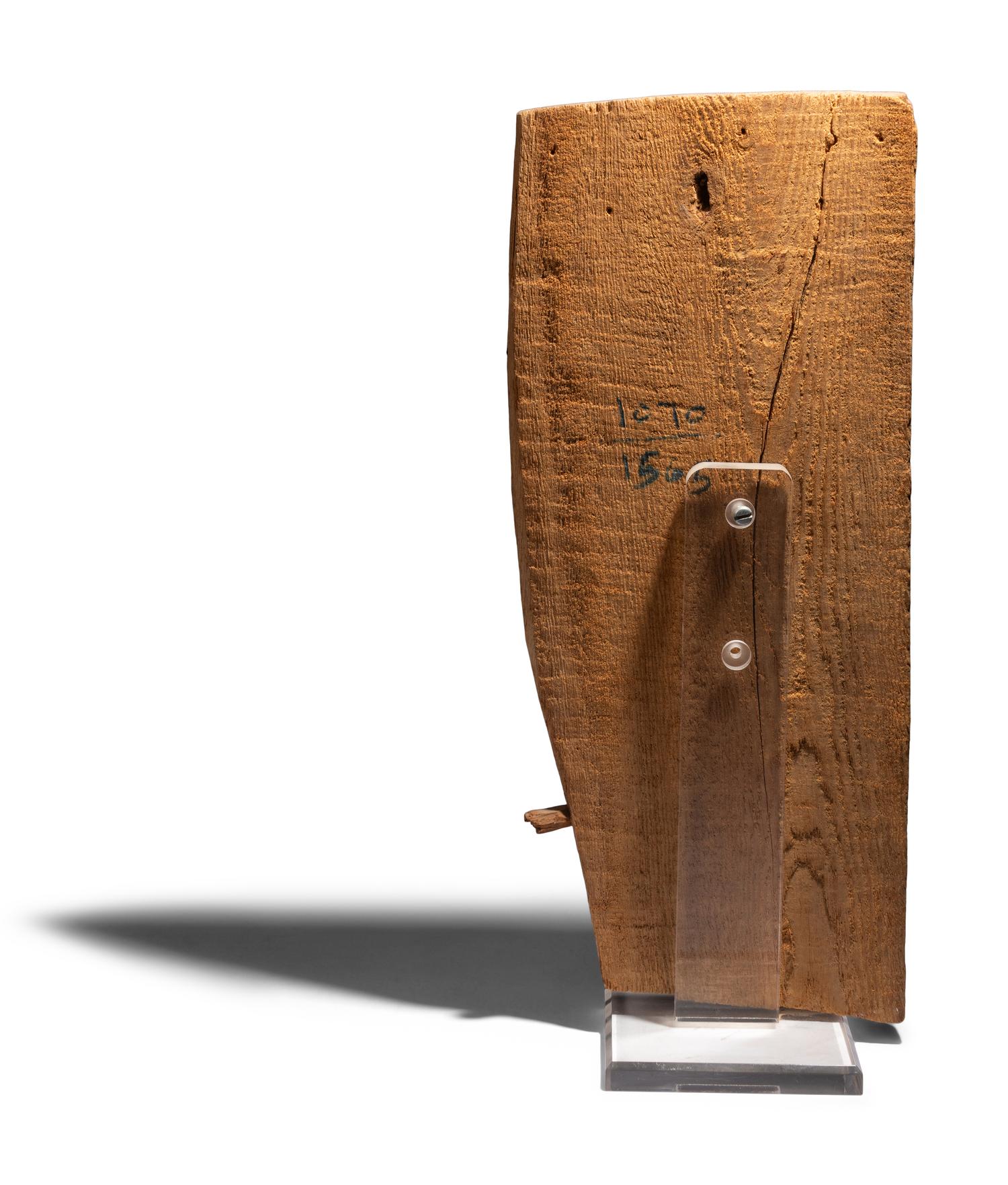 An Egyptian Painted Wood Sarcophagus Fragment with Anubis