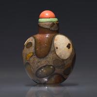 A Chinese Puddingstone Snuff Bottle, Qing Dynasty, 19th Century — 清晚期 抱子石素面鼻煙壺