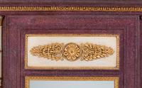 A Directoire Faux Porphyry Painted and Parcel Gilt Mirror