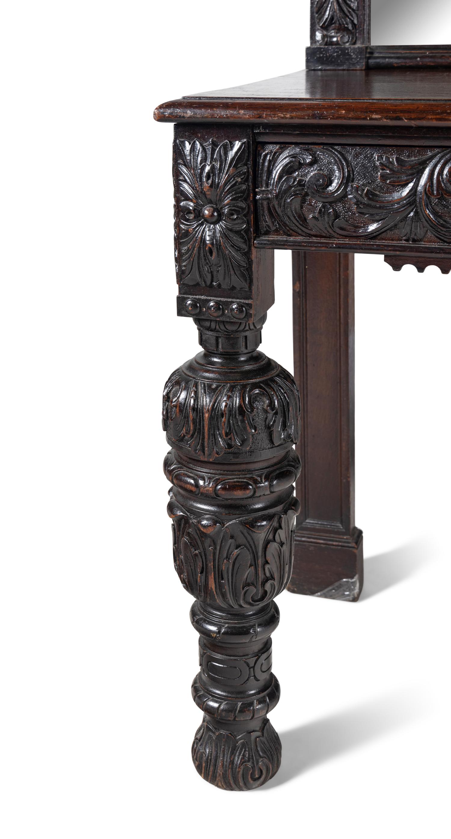 A Jacobean Style Carved Oak Sideboard and Mirror