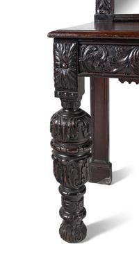 A Jacobean Style Carved Oak Sideboard and Mirror