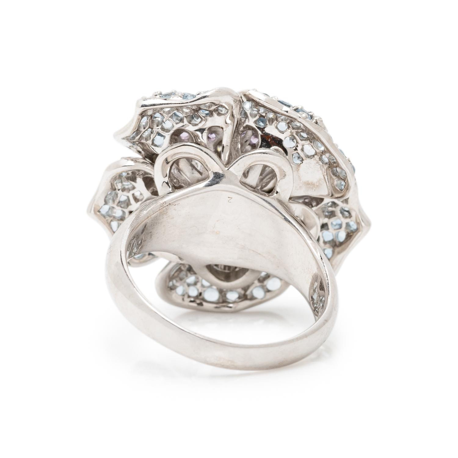 SONIA B., WHITE GOLD, DIAMOND, AQUAMARINE, AND PURPLE SAPPHIRE FLOWER RING