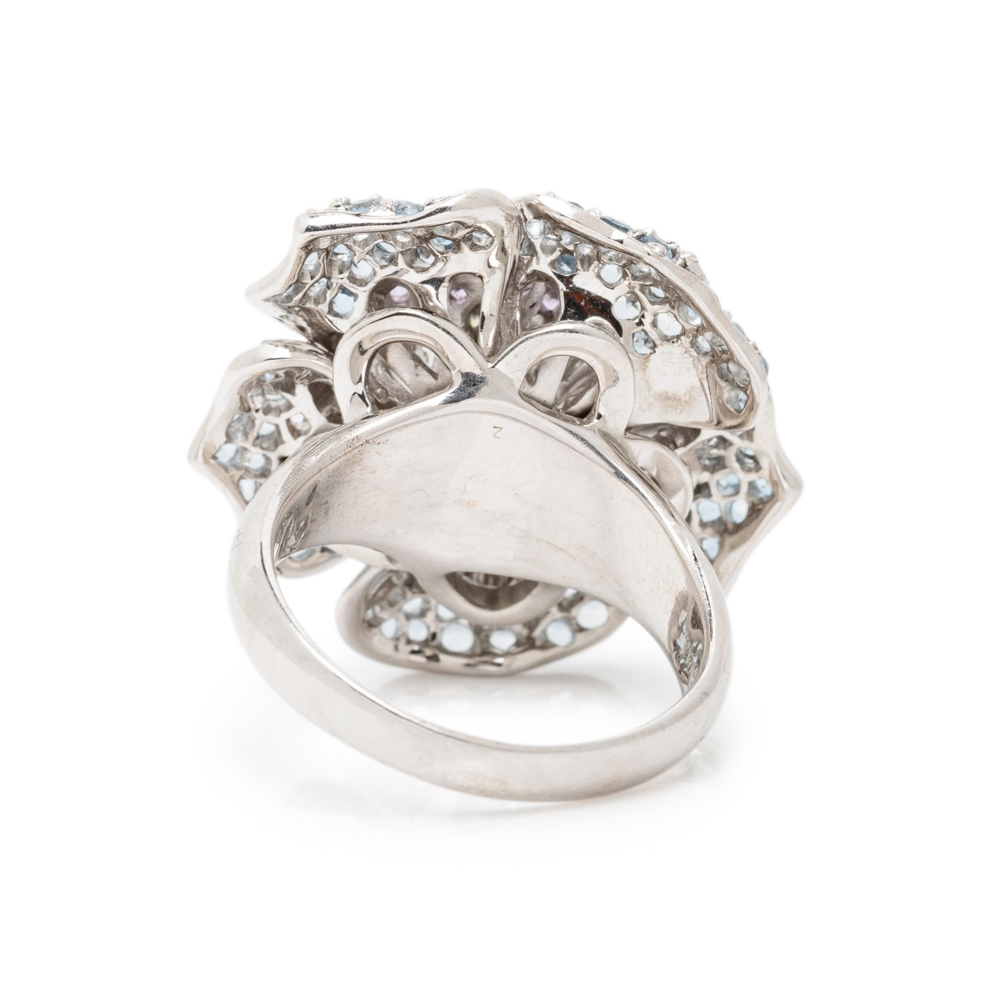 SONIA B., WHITE GOLD, DIAMOND, AQUAMARINE, AND PURPLE SAPPHIRE FLOWER RING