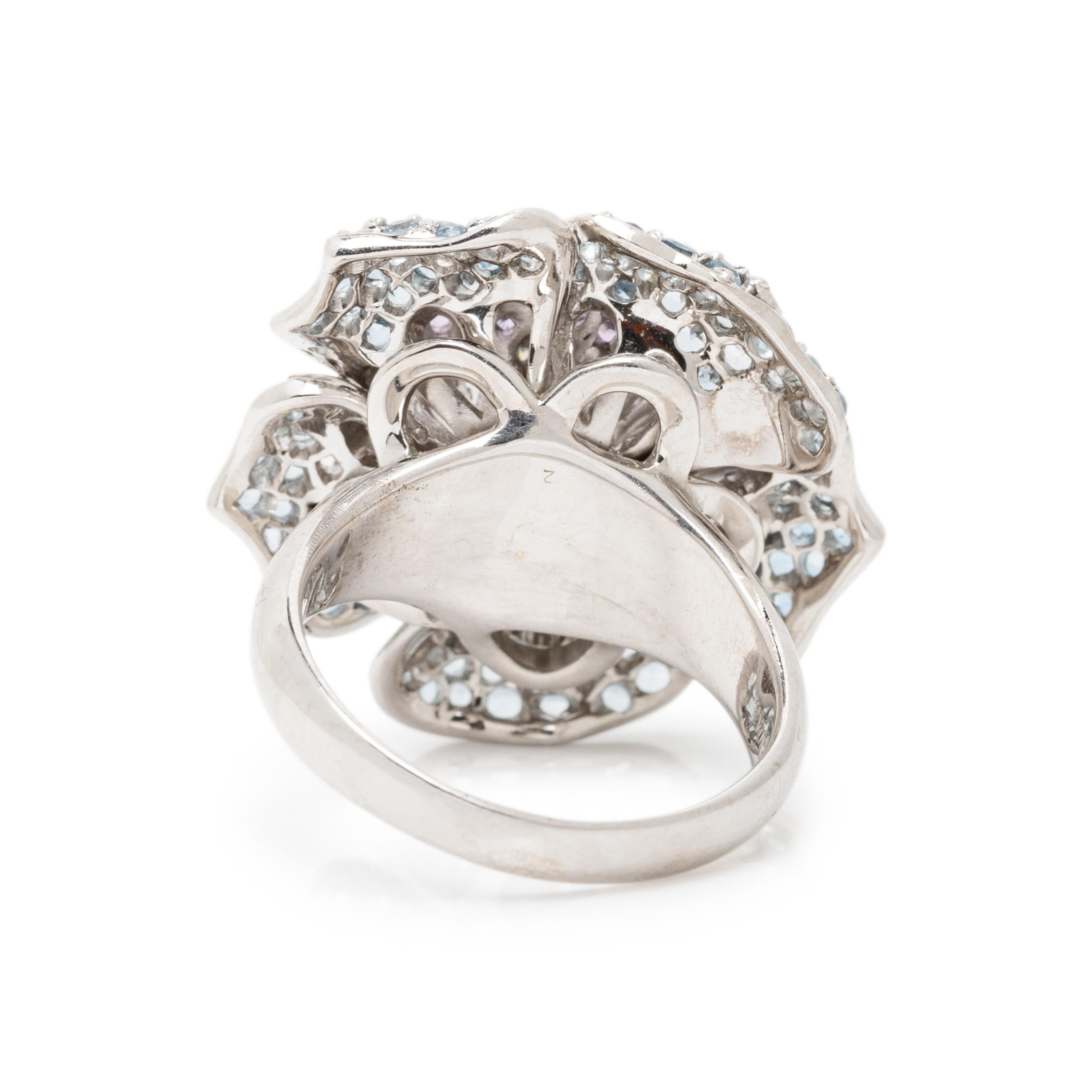 SONIA B., WHITE GOLD, DIAMOND, AQUAMARINE, AND PURPLE SAPPHIRE FLOWER RING