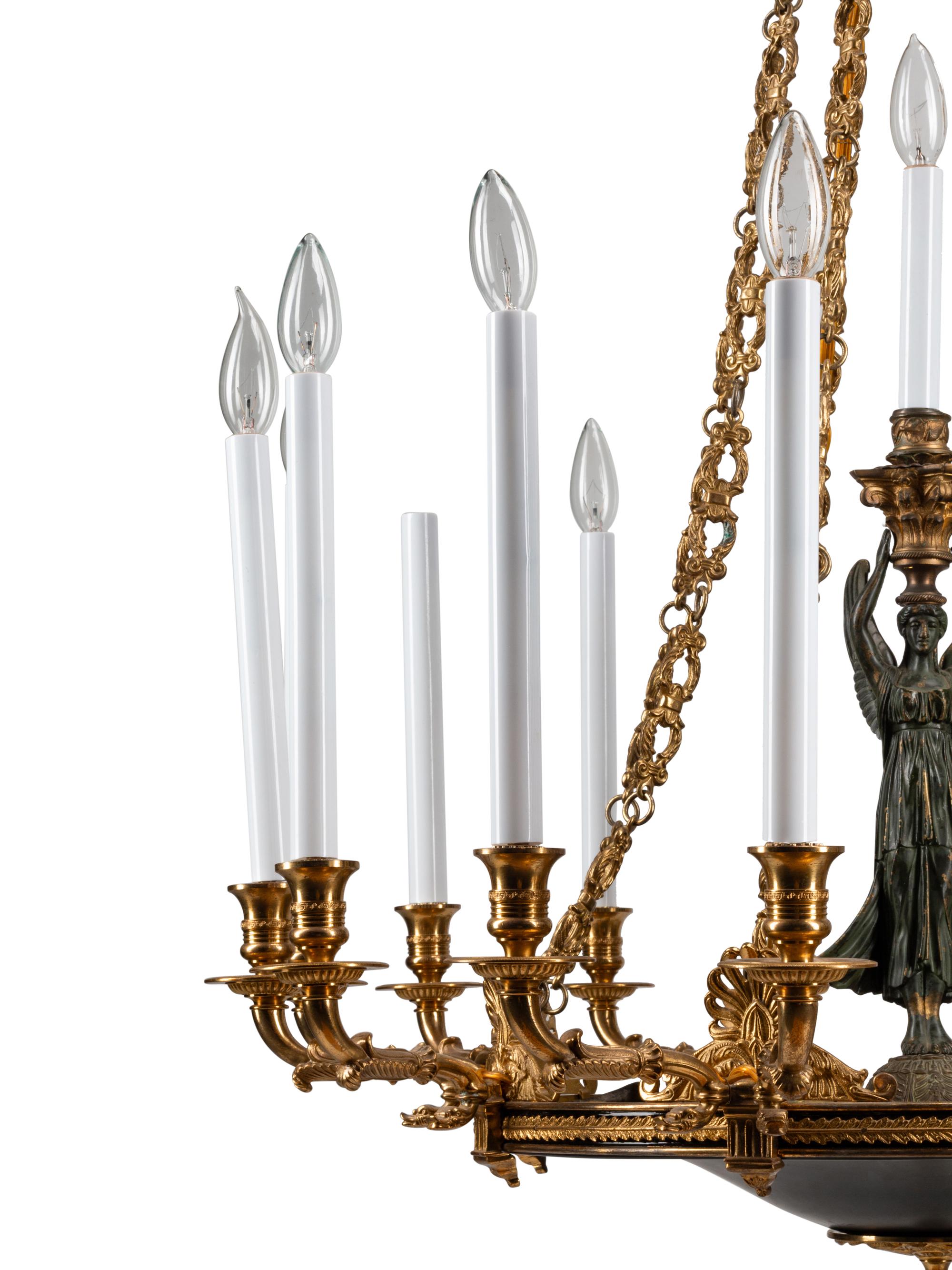 An Empire Style Gilt Bronze and Tole Sixteen-Light Chandelier