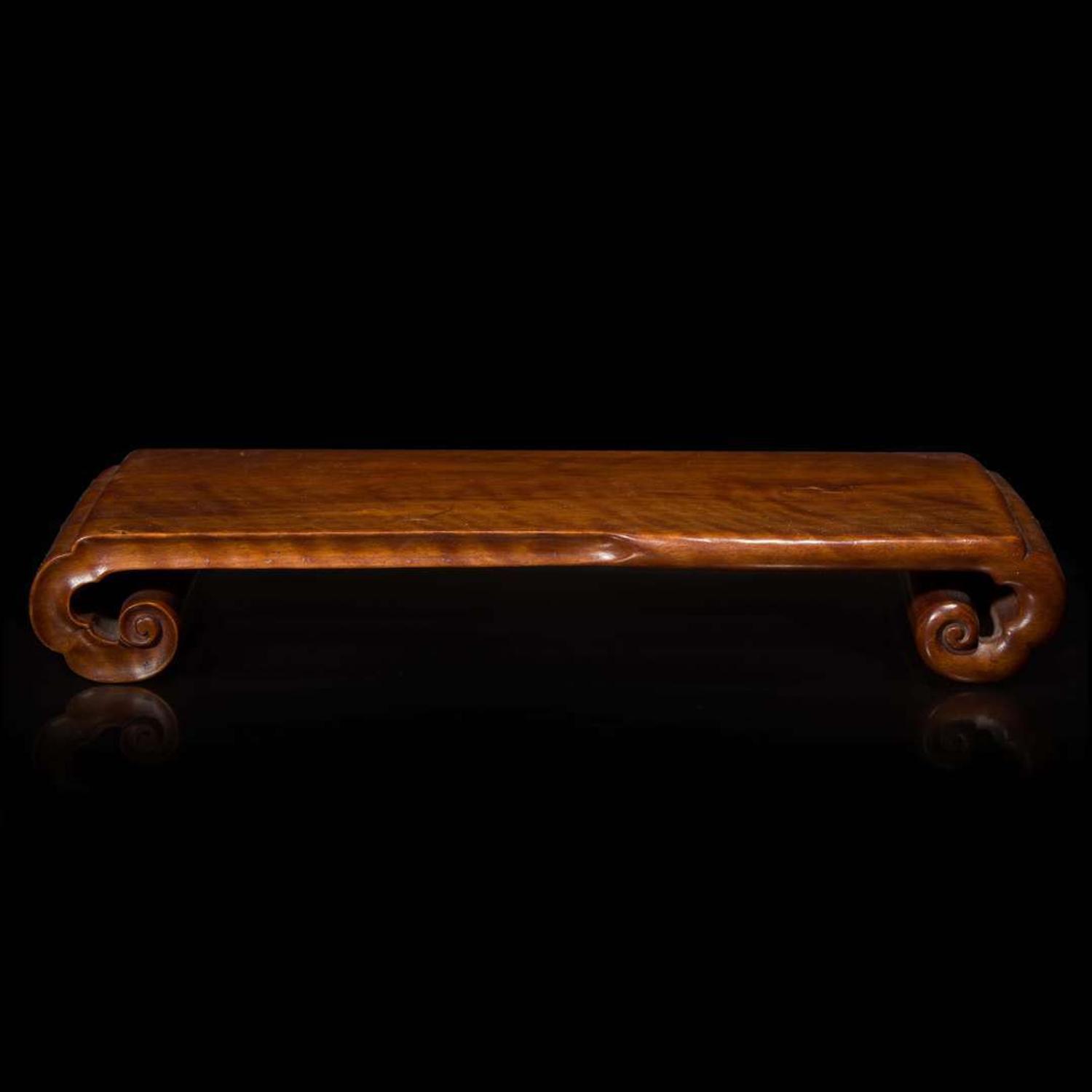 A Chinese carved Longyan wood scrolled stand 龍眼木座子 Qing dynasty ?