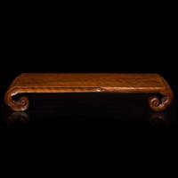A Chinese carved Longyan wood scrolled stand 龍眼木座子 Qing dynasty ?