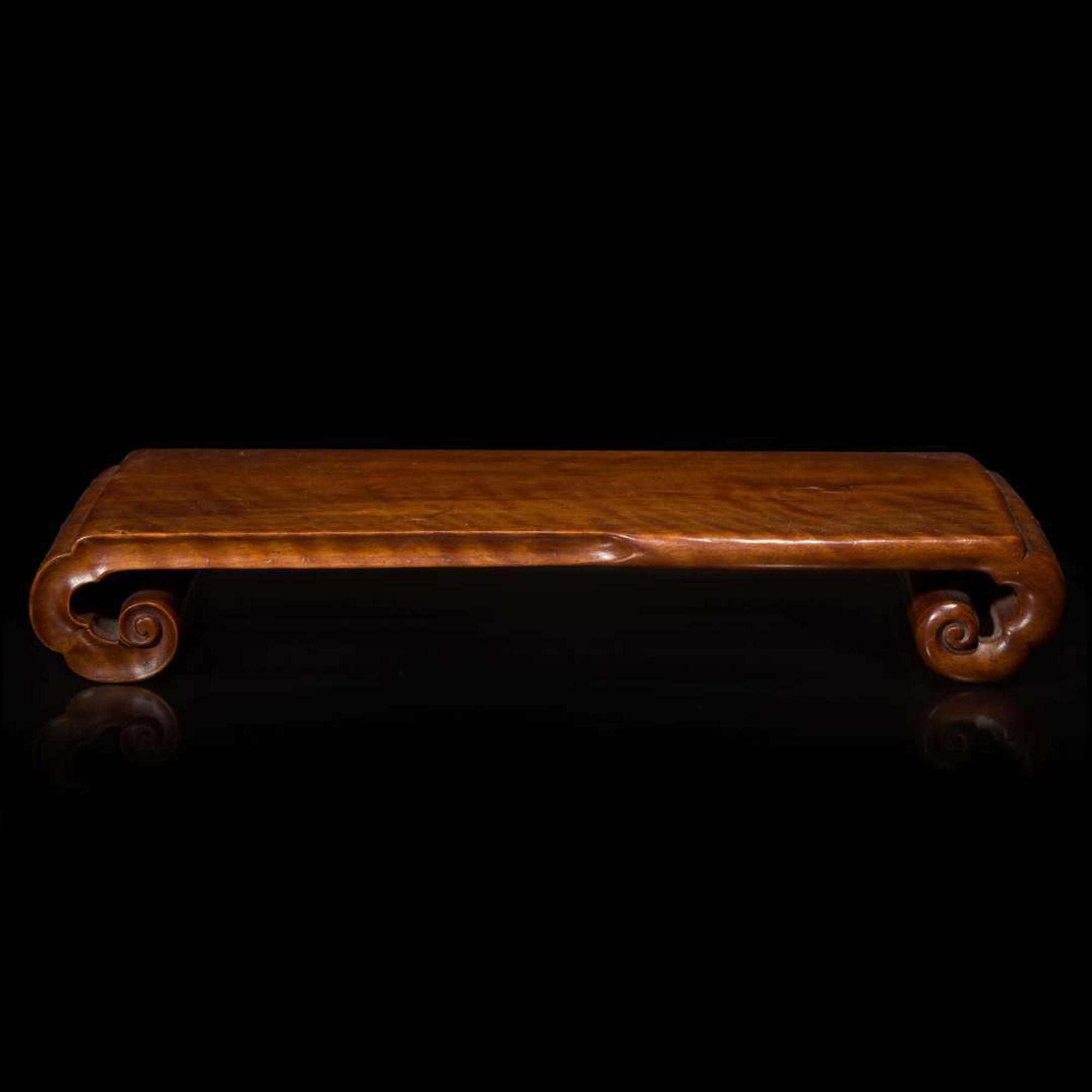 A Chinese carved Longyan wood scrolled stand 龍眼木座子 Qing dynasty ?