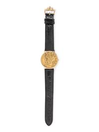 BAUME & MERCIER, YELLOW GOLD HIDDEN DIAL COIN WATCH