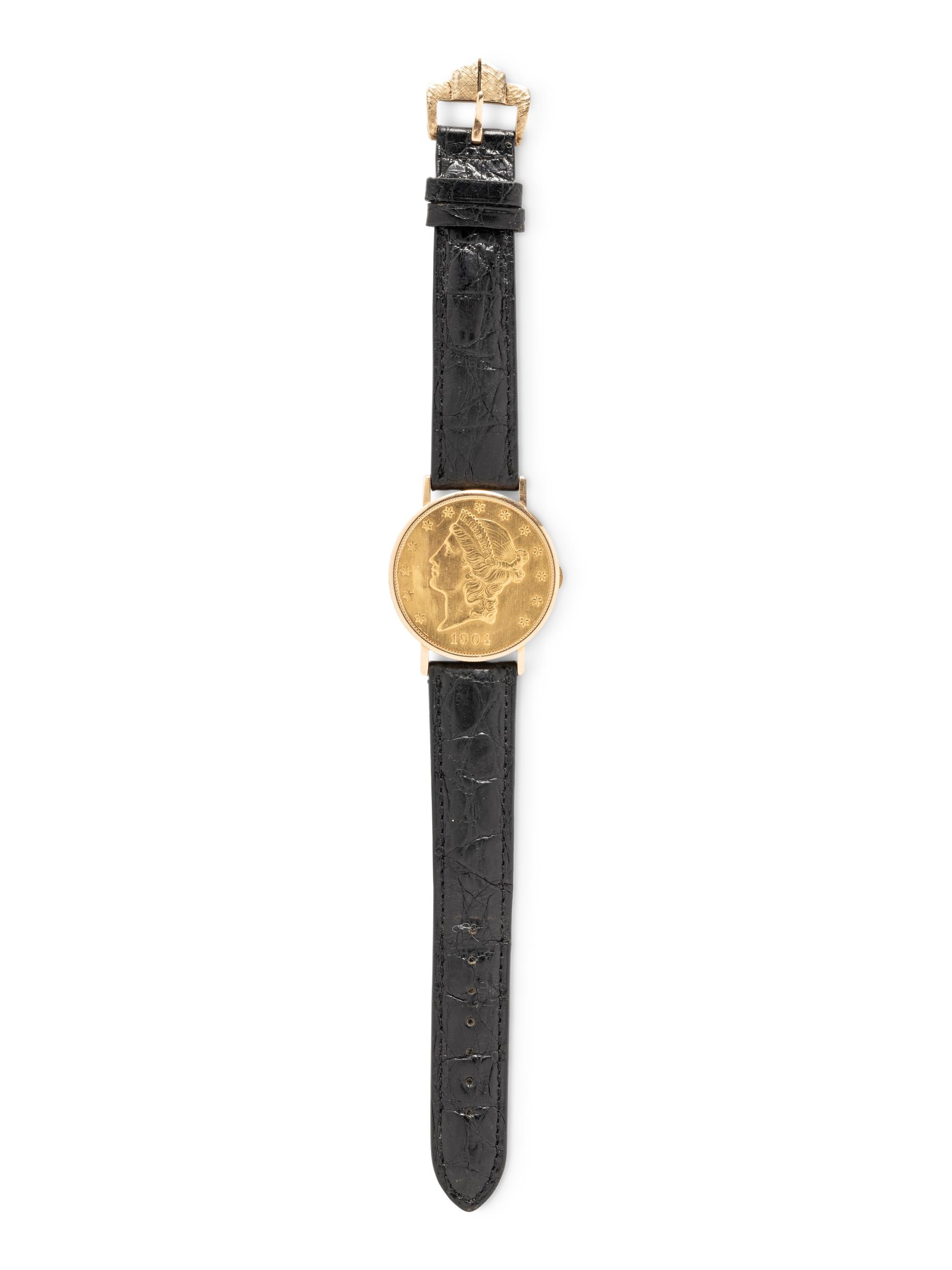 BAUME & MERCIER, YELLOW GOLD HIDDEN DIAL COIN WATCH