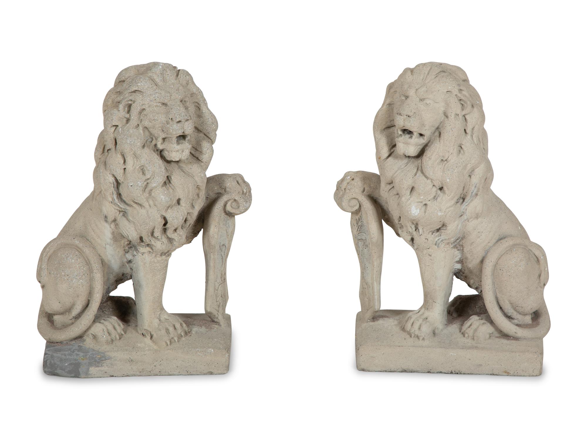 A Pair of Cast Stone Seated Lions