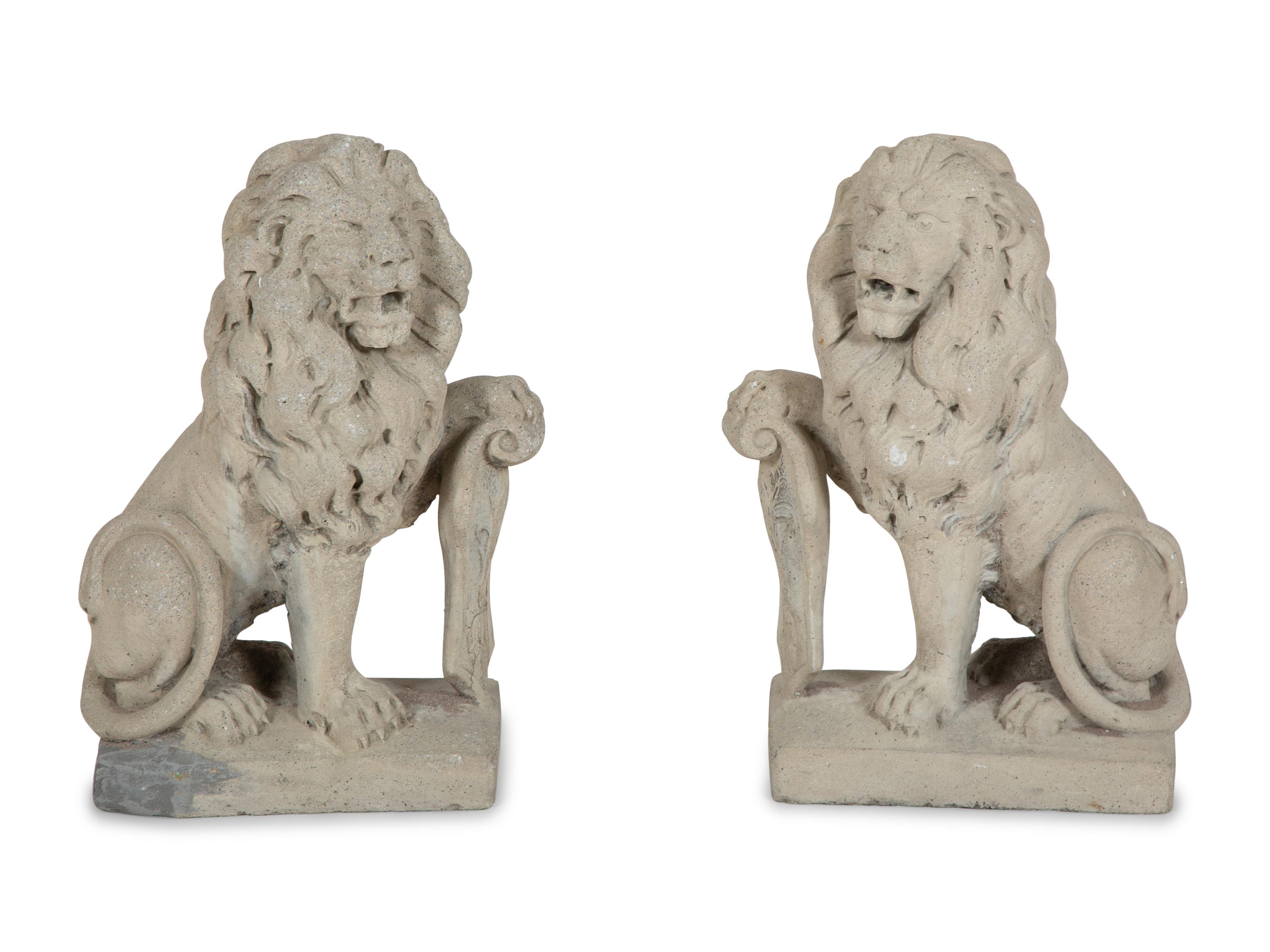 A Pair of Cast Stone Seated Lions