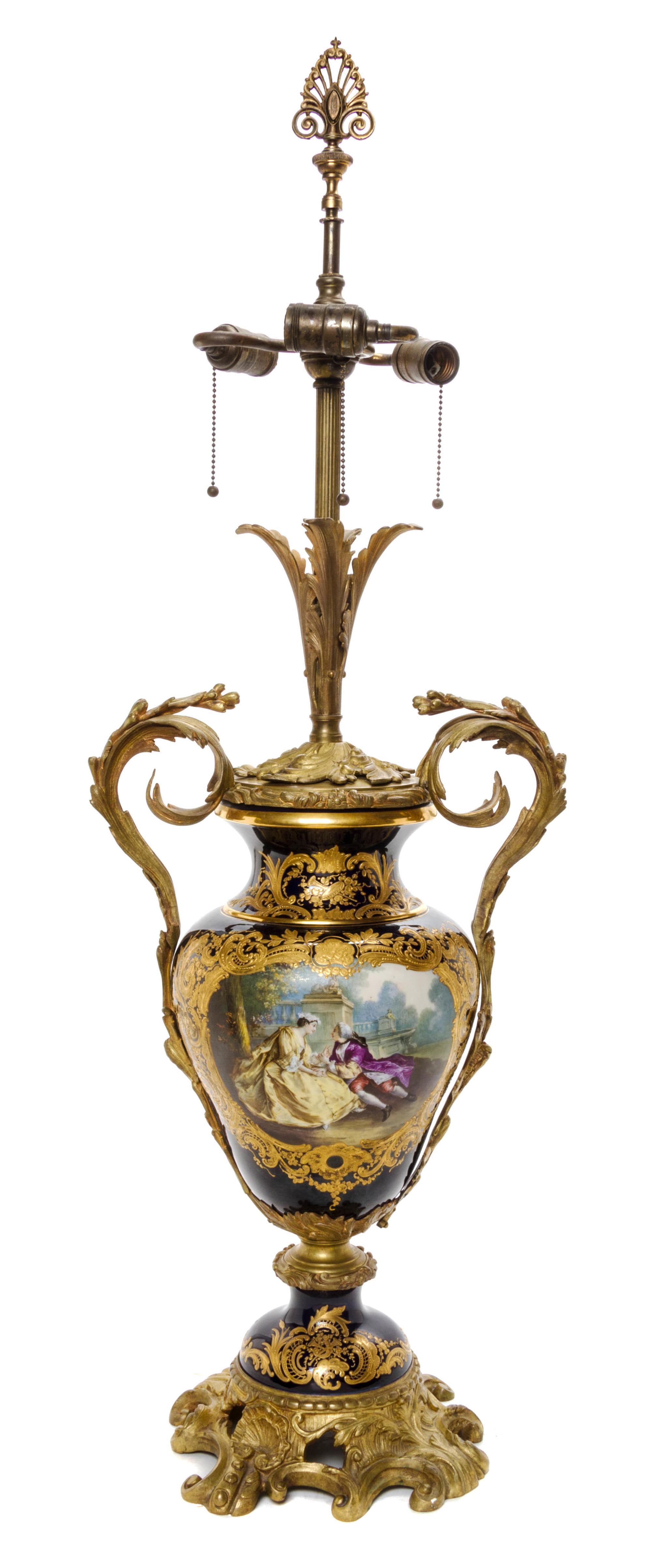 A Sevres Style Gilt Bronze Mounted Porcelain Urn, Height of porcelain 17 1/2 inches.