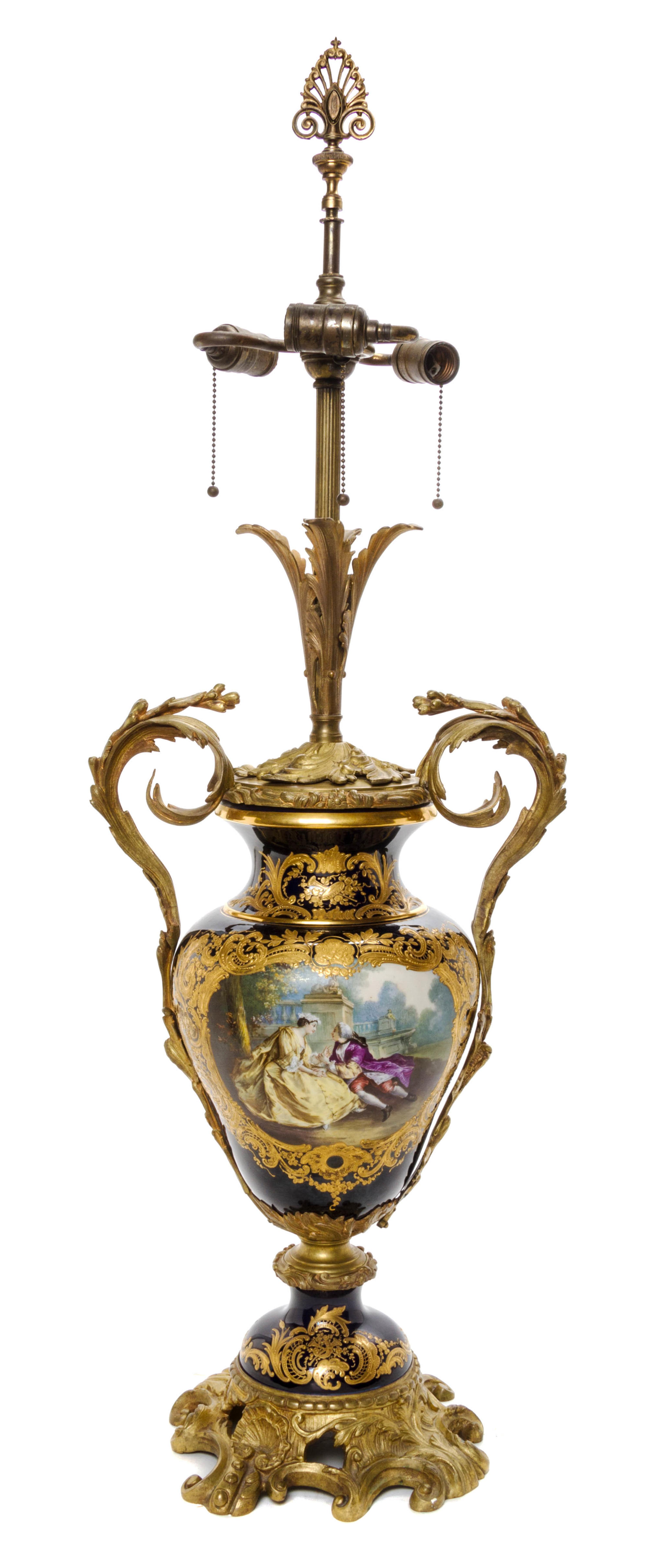 A Sevres Style Gilt Bronze Mounted Porcelain Urn, Height of porcelain 17 1/2 inches.
