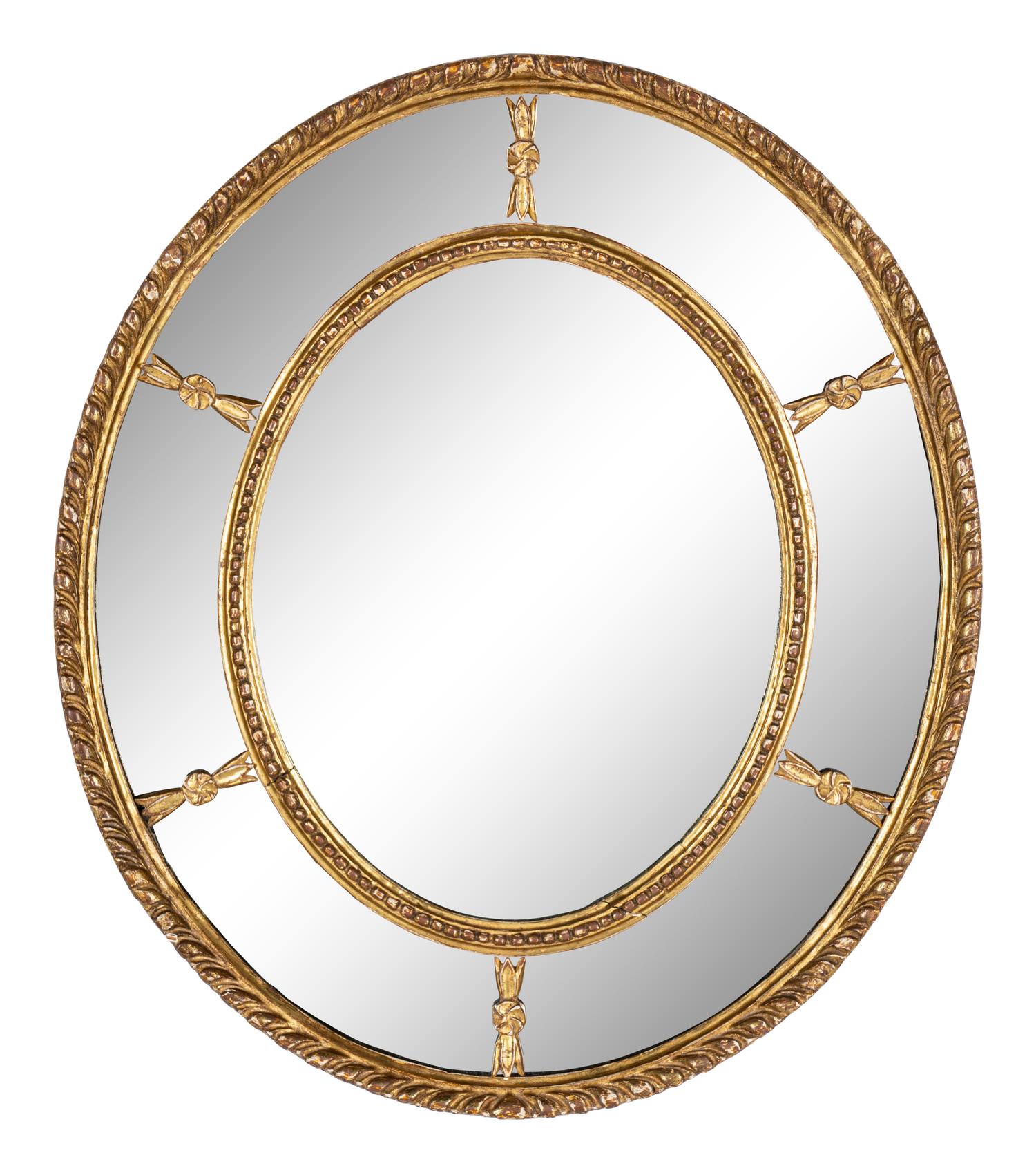 A Near Pair of George III Giltwood Oval Mirrors