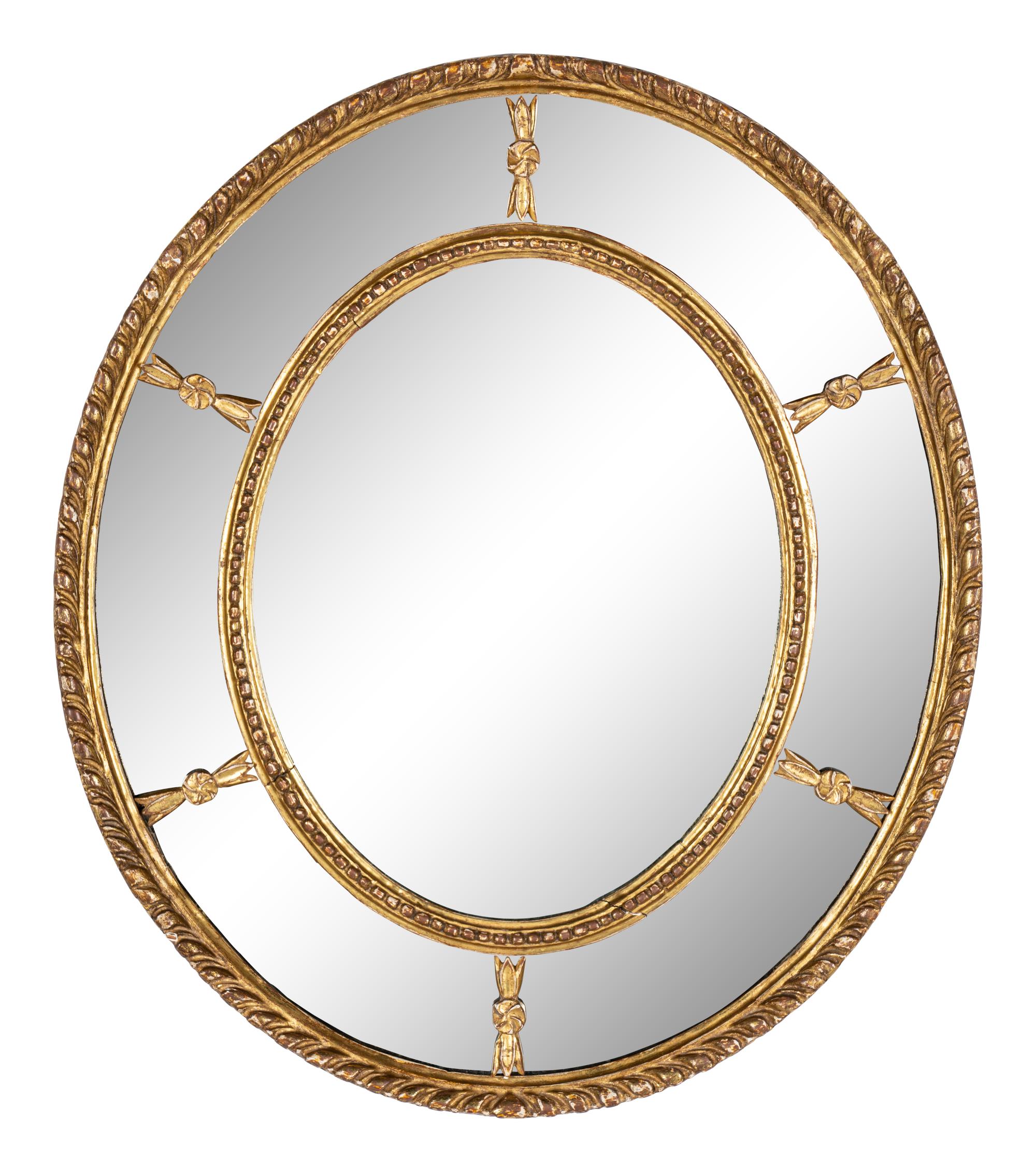 A Near Pair of George III Giltwood Oval Mirrors