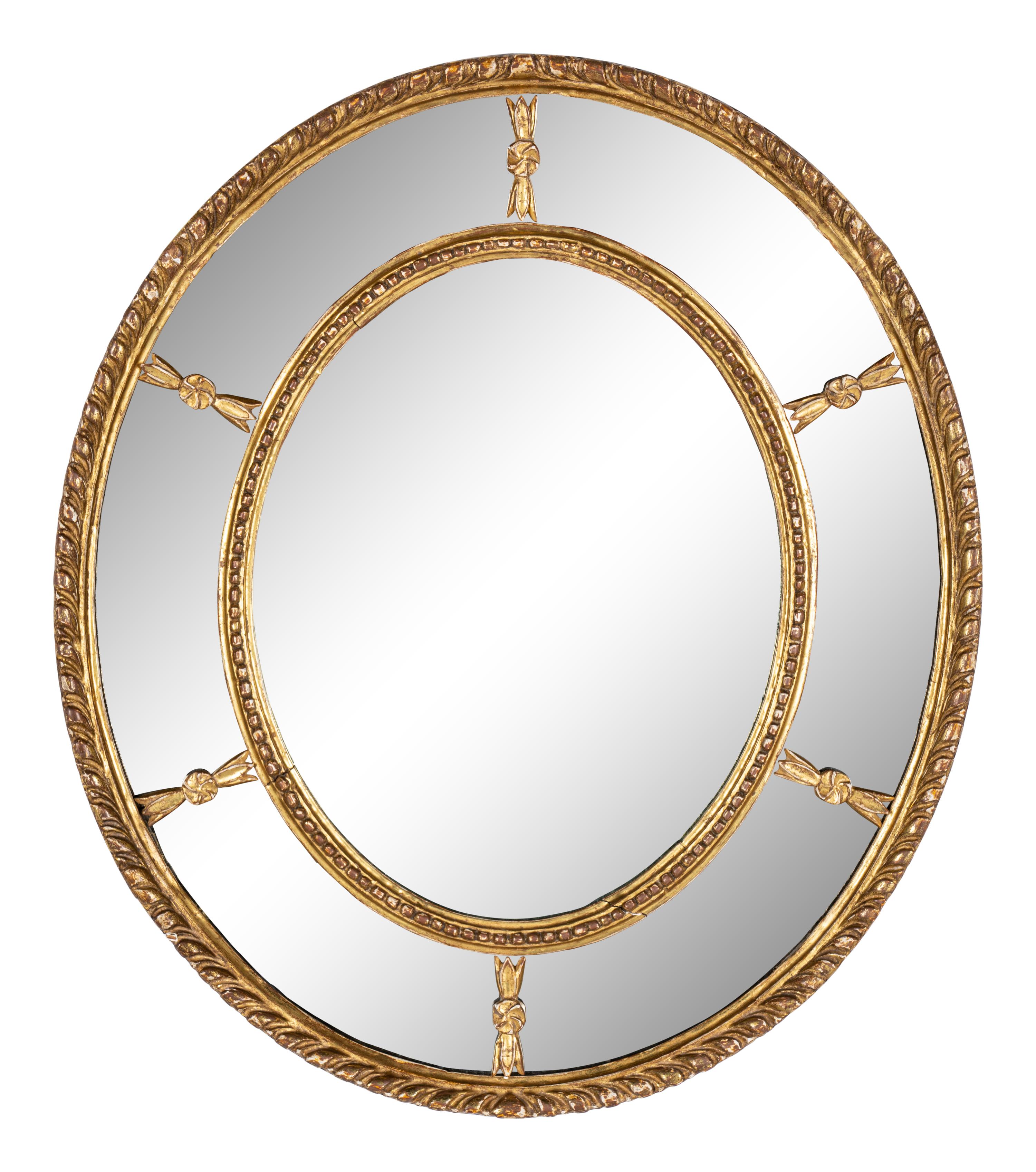 A Near Pair of George III Giltwood Oval Mirrors