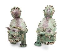 A Pair of Shiwan Red and Green Glazed Stoneware Figures of Fu Lions
