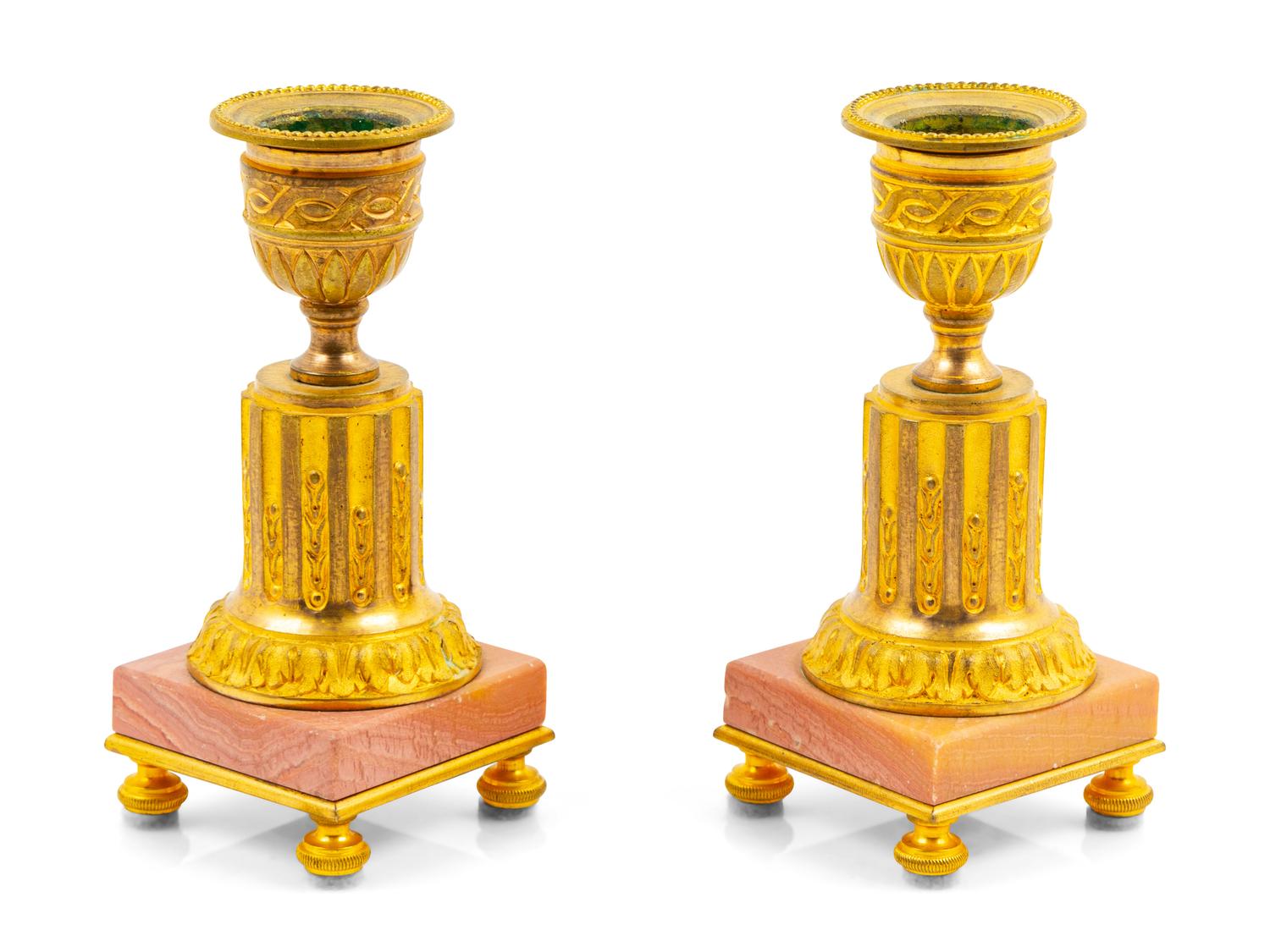 A Pair of Gilt Metal Candlesticks