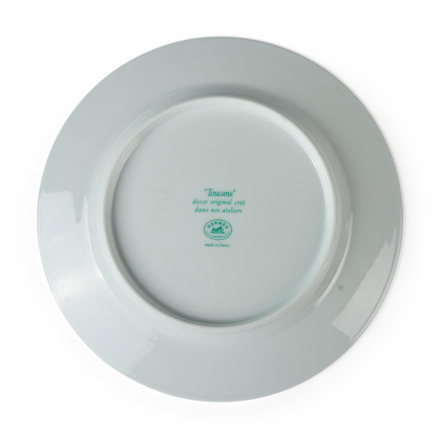 An Hermès Toucans Porcelain Dinner Service