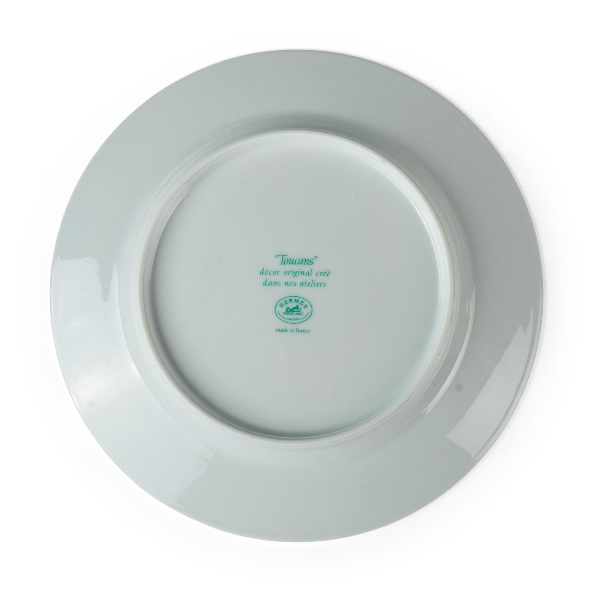 An Hermès Toucans Porcelain Dinner Service