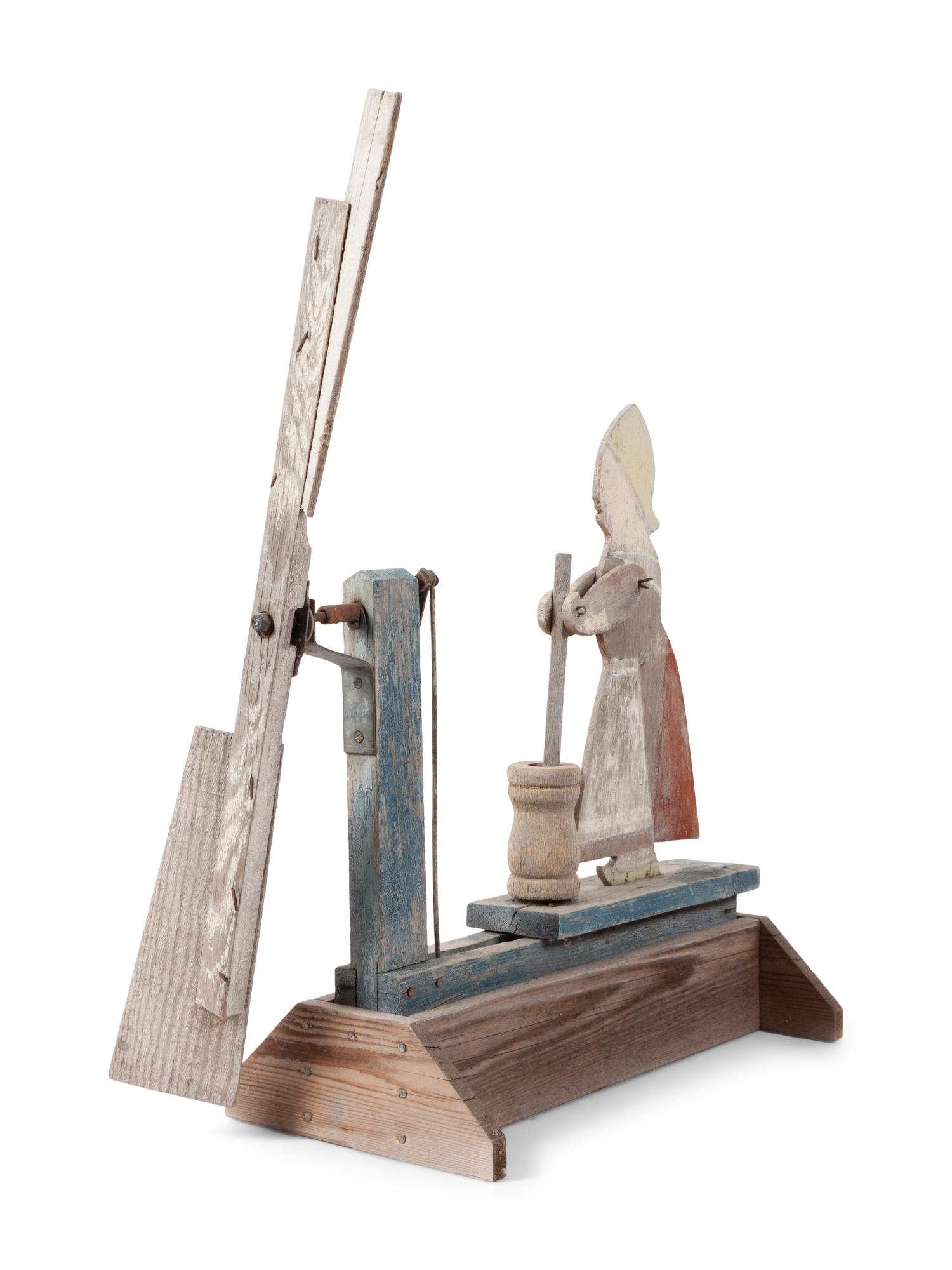 A Folk Art Carved and Painted Wood Butter Churn Whirligig