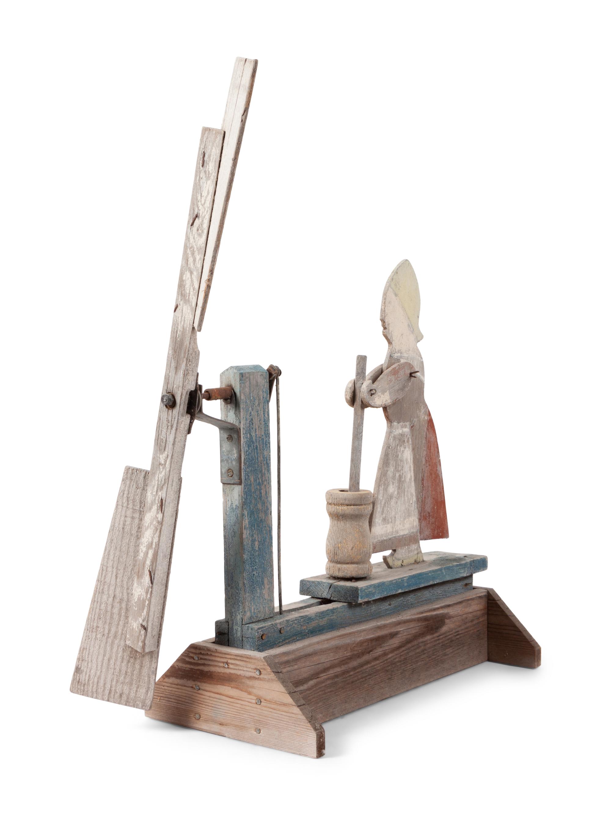 A Folk Art Carved and Painted Wood Butter Churn Whirligig