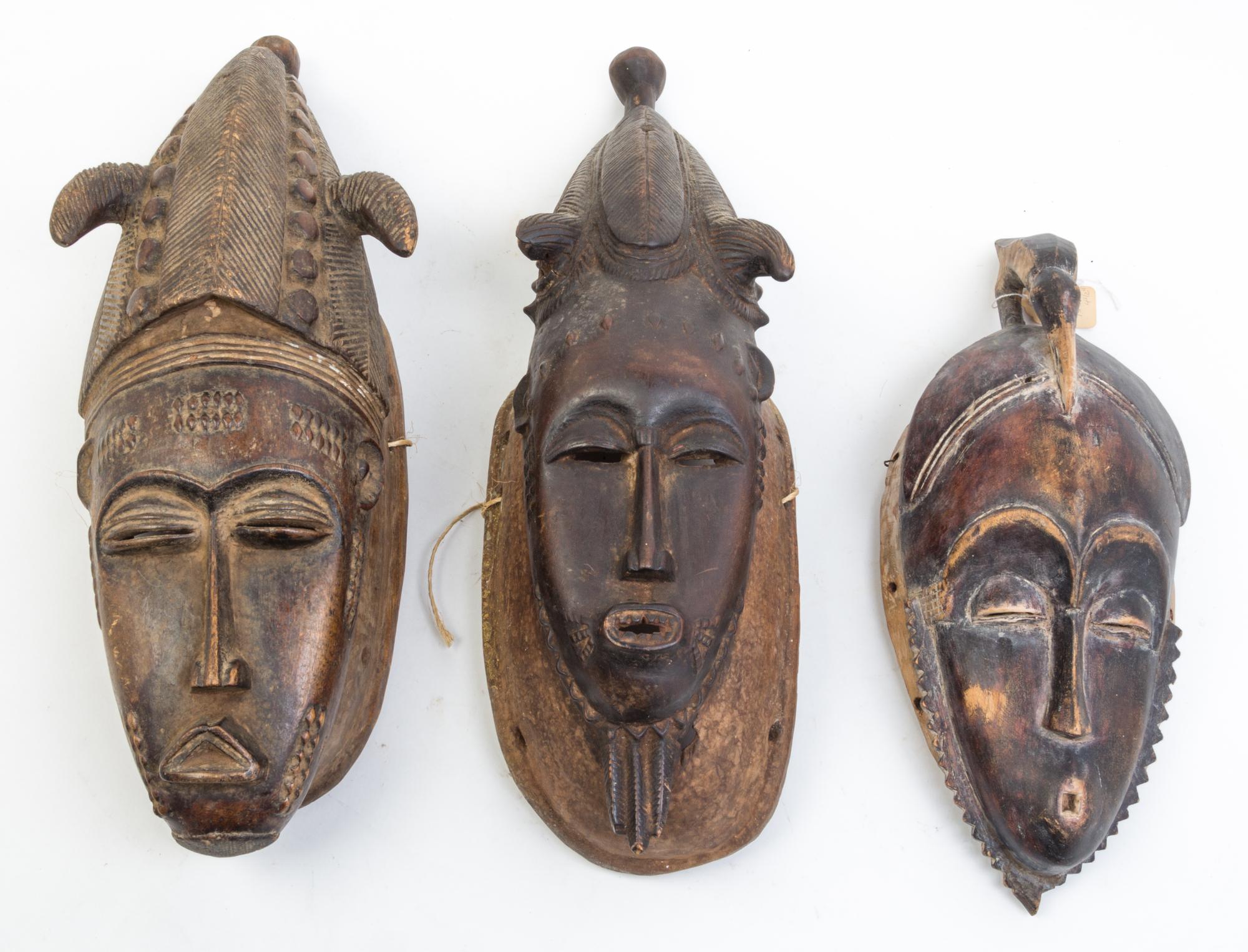 A Group of Six Masks Height of largest 21 inches.