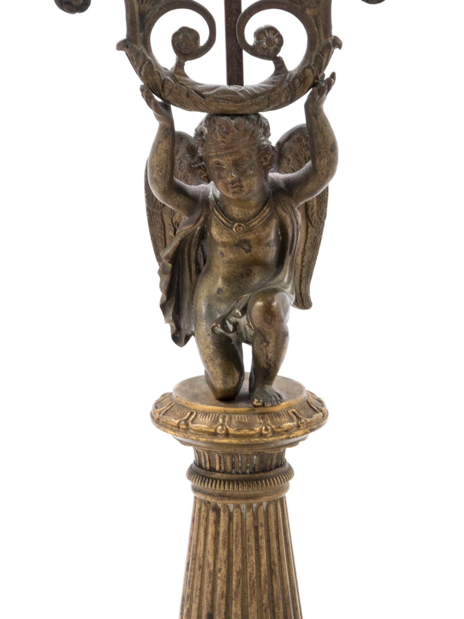 A French Gilt Bronze Candlestick and Figural Mirror