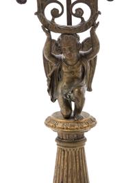 A French Gilt Bronze Candlestick and Figural Mirror