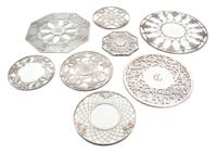 Eight Silver Overlay Glass Trivets Diameter of largest 12 inches.