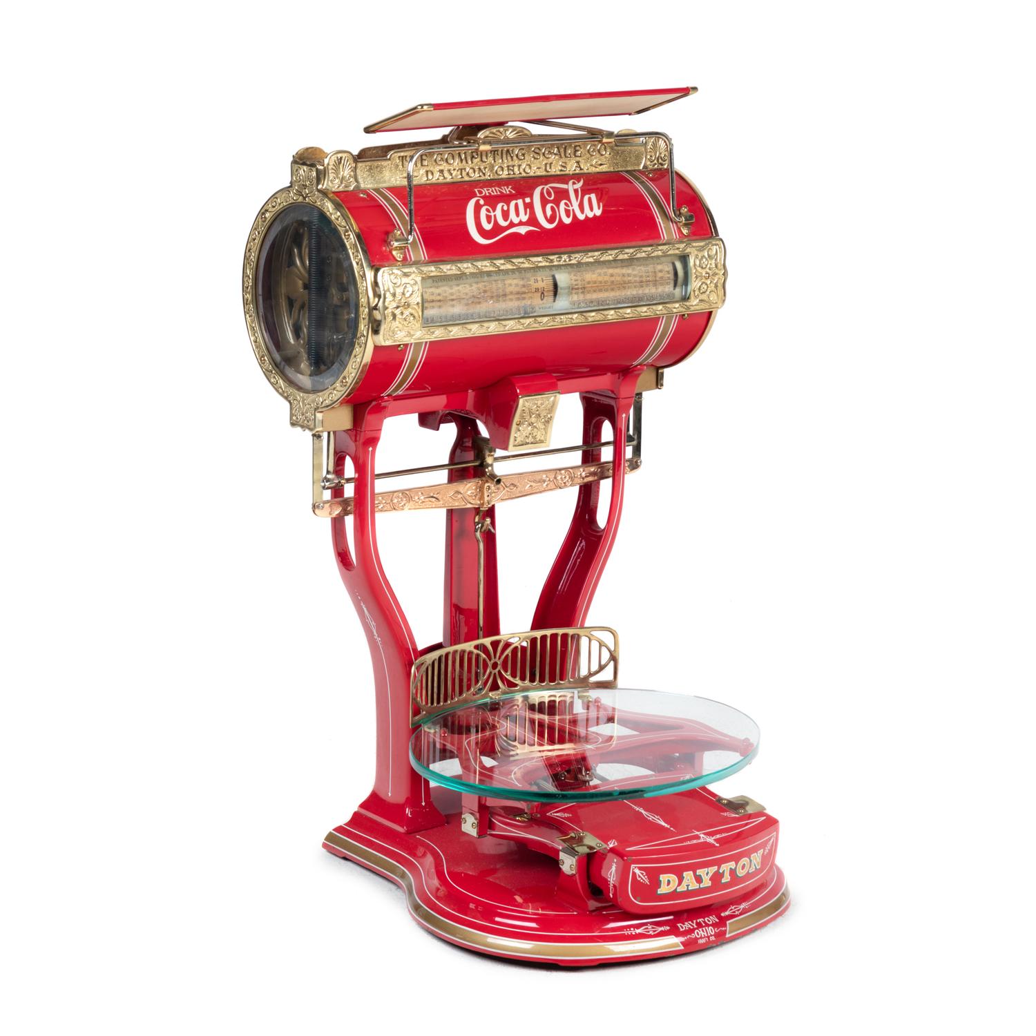 A Red Dayton Computing Scale with Coca-Cola Advertisement