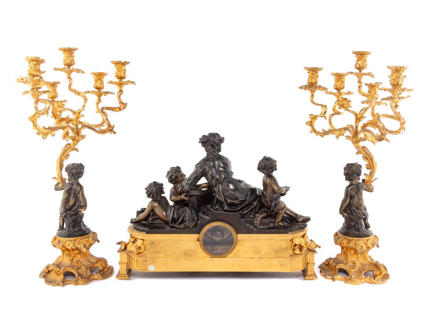 A French Gilt and Patinated Bronze Clock Garniture