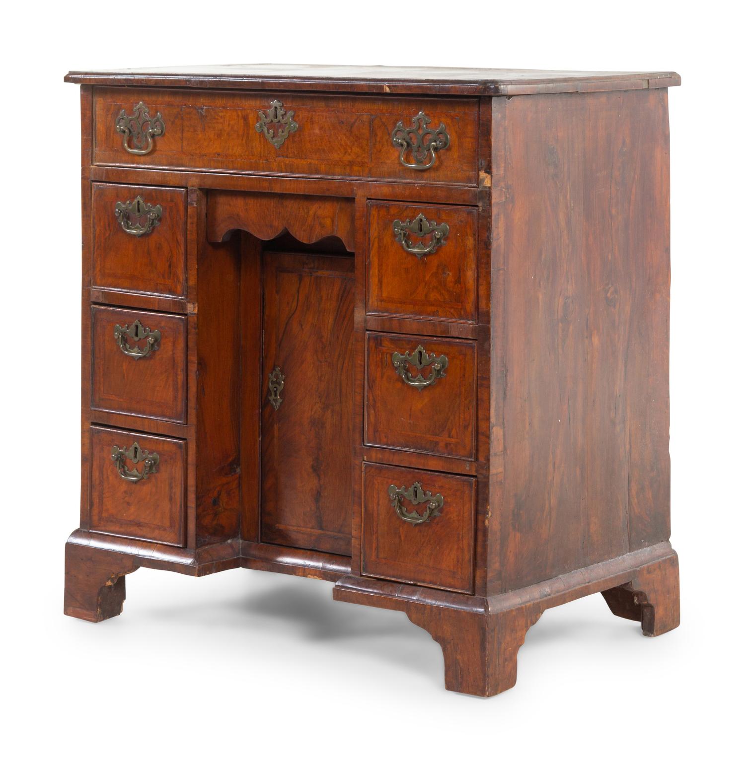 A George II Walnut Kneehole Desk