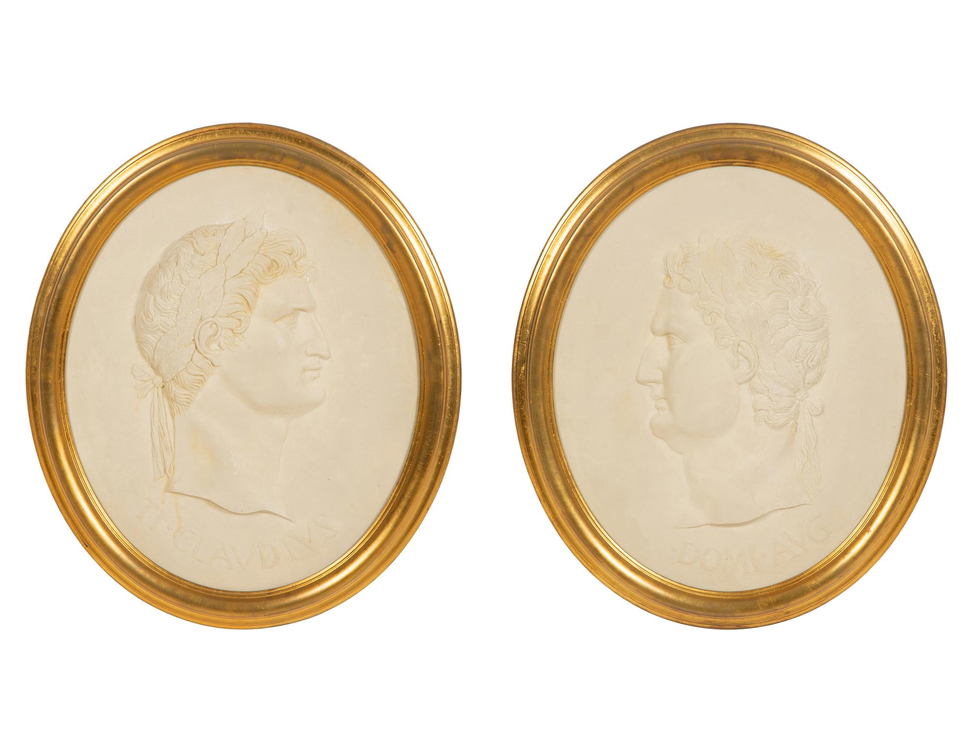 A Pair of Roman Style Composition Relief Plaques in Giltwood Frames