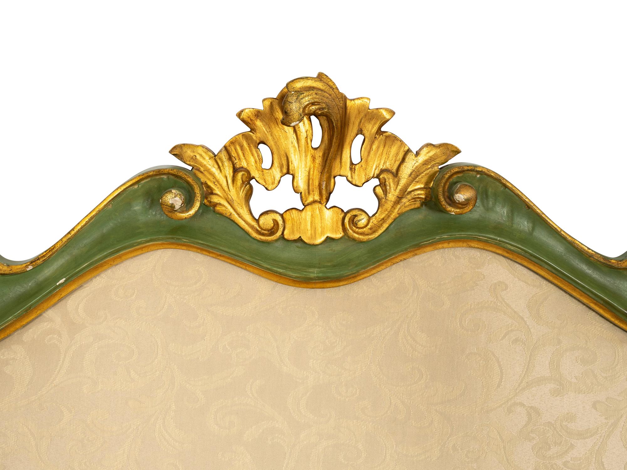 An Italian Green Painted and Parcel Gilt Headboard