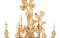 A Carved Fruitwood Ten Light Chandelier