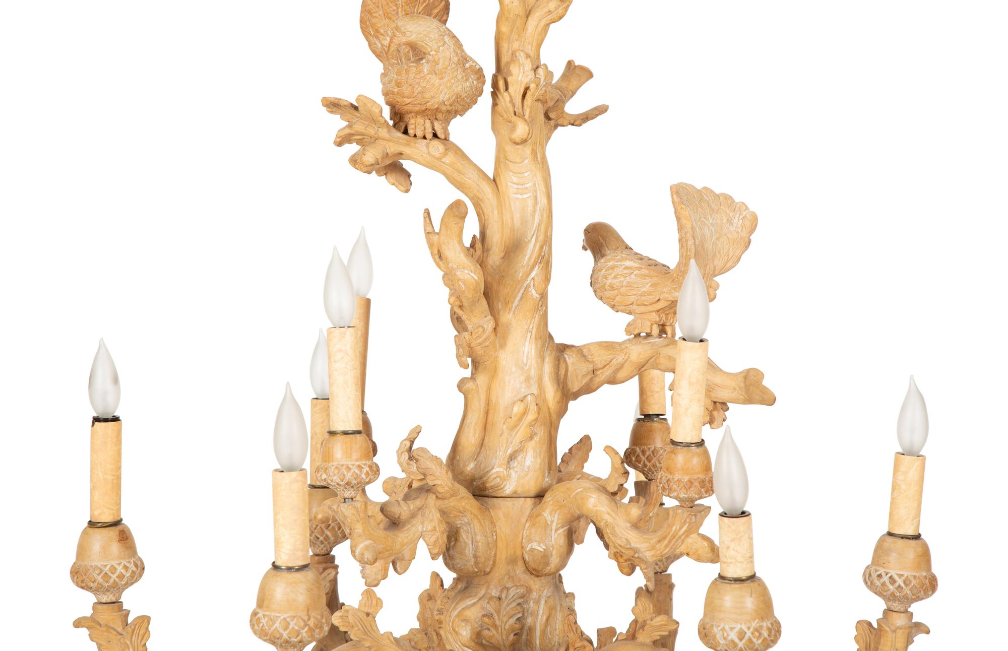 A Carved Fruitwood Ten Light Chandelier