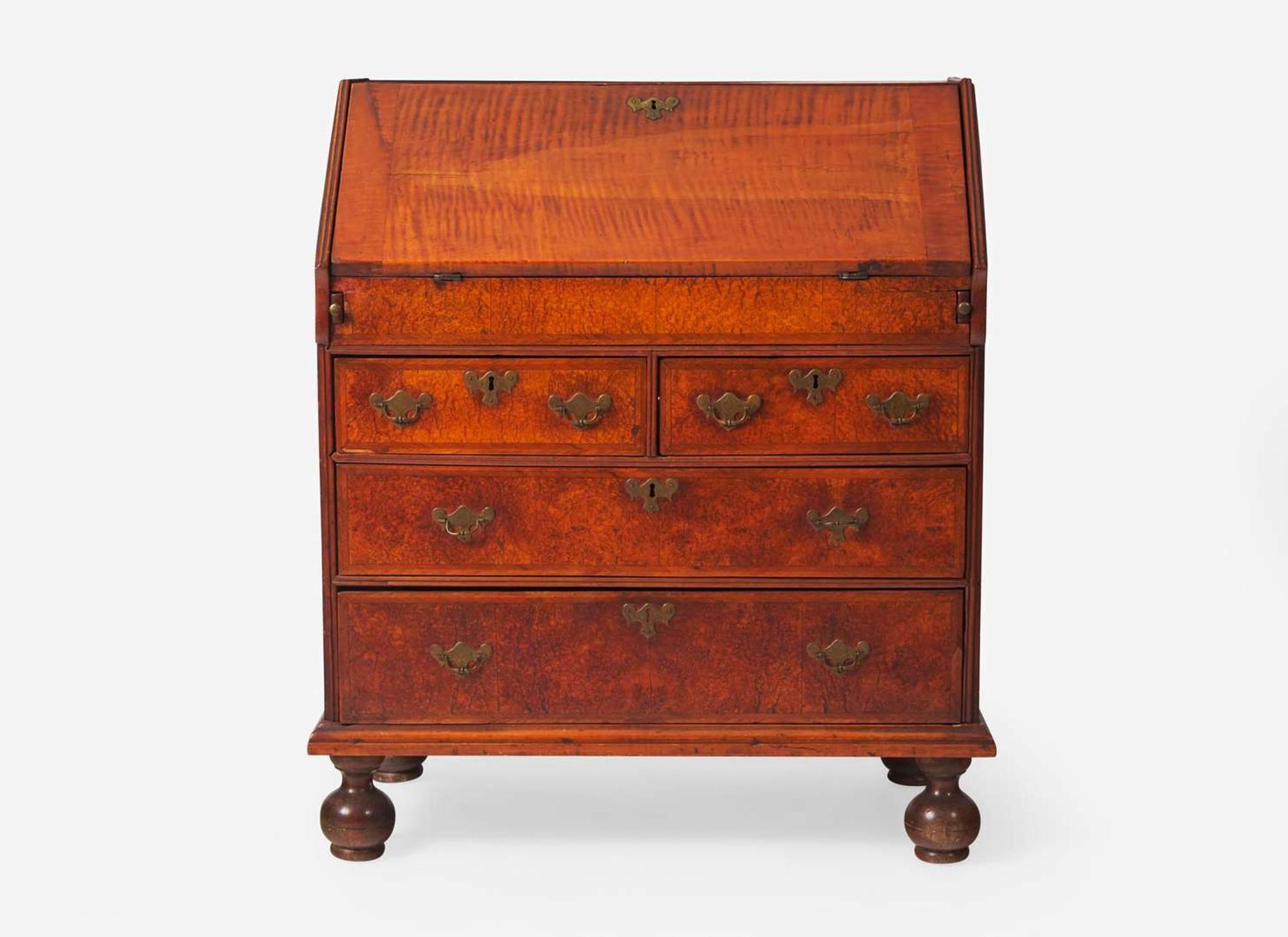 A William & Mary tiger maple and burl walnut veneered slant-front desk, New England, circa 1730