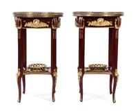 A Pair of Louis XVI Style Gilt Metal and Porcelain Mounted Marquetry Decorated Mahogany Side Tables, Height 31 x diameter 18 inches.