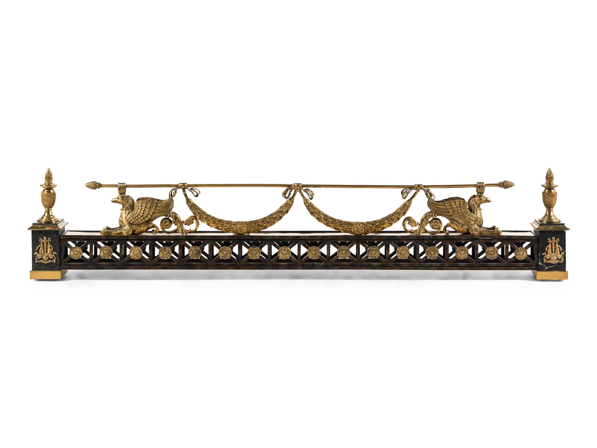 An Empire Style Gilt and Patinated Bronze Fireplace Fender