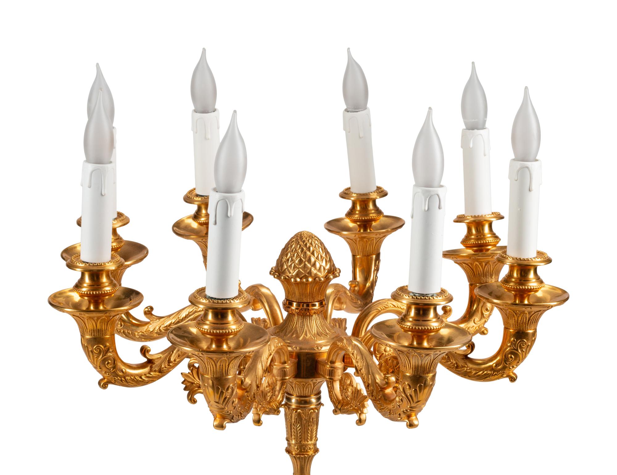 An Empire Style Gilt and Patinated Bronze Eight-Light Candelabrum