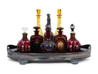 Eight Colored Glass Decanters and a Silver-Plate Galleried Serving Tray