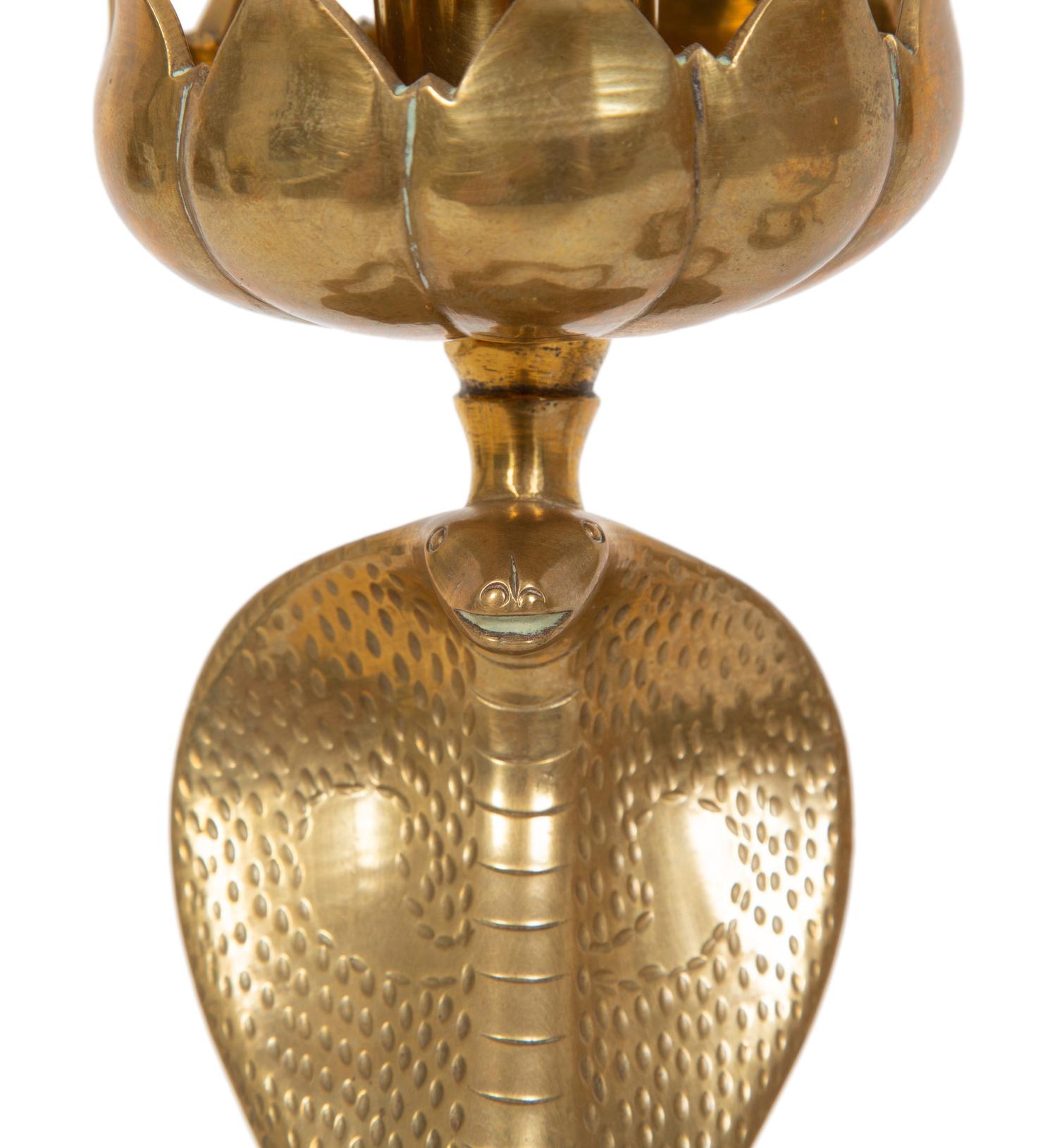 A Pair of Brass Cobra Candlesticks