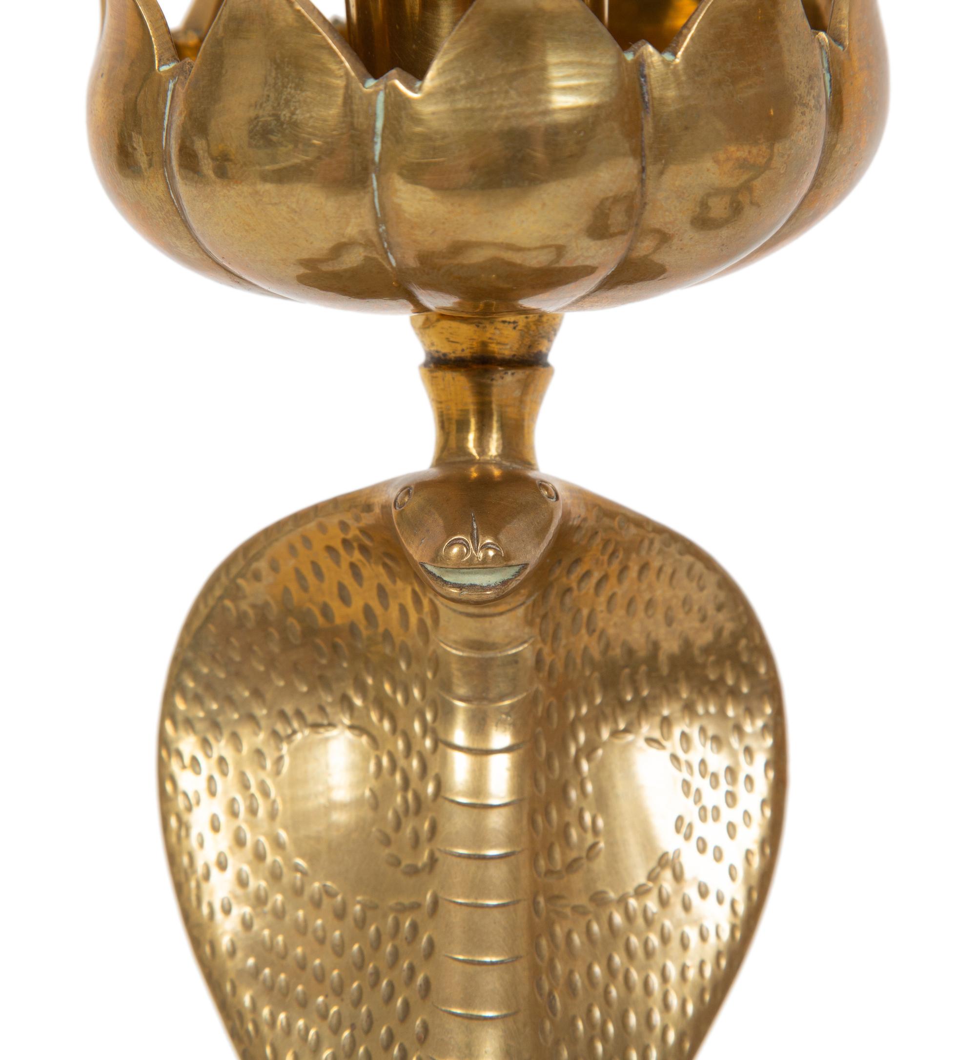 A Pair of Brass Cobra Candlesticks