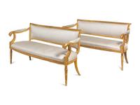 A Pair of Northern Italian Giltwood Sofas with Griffin Supports